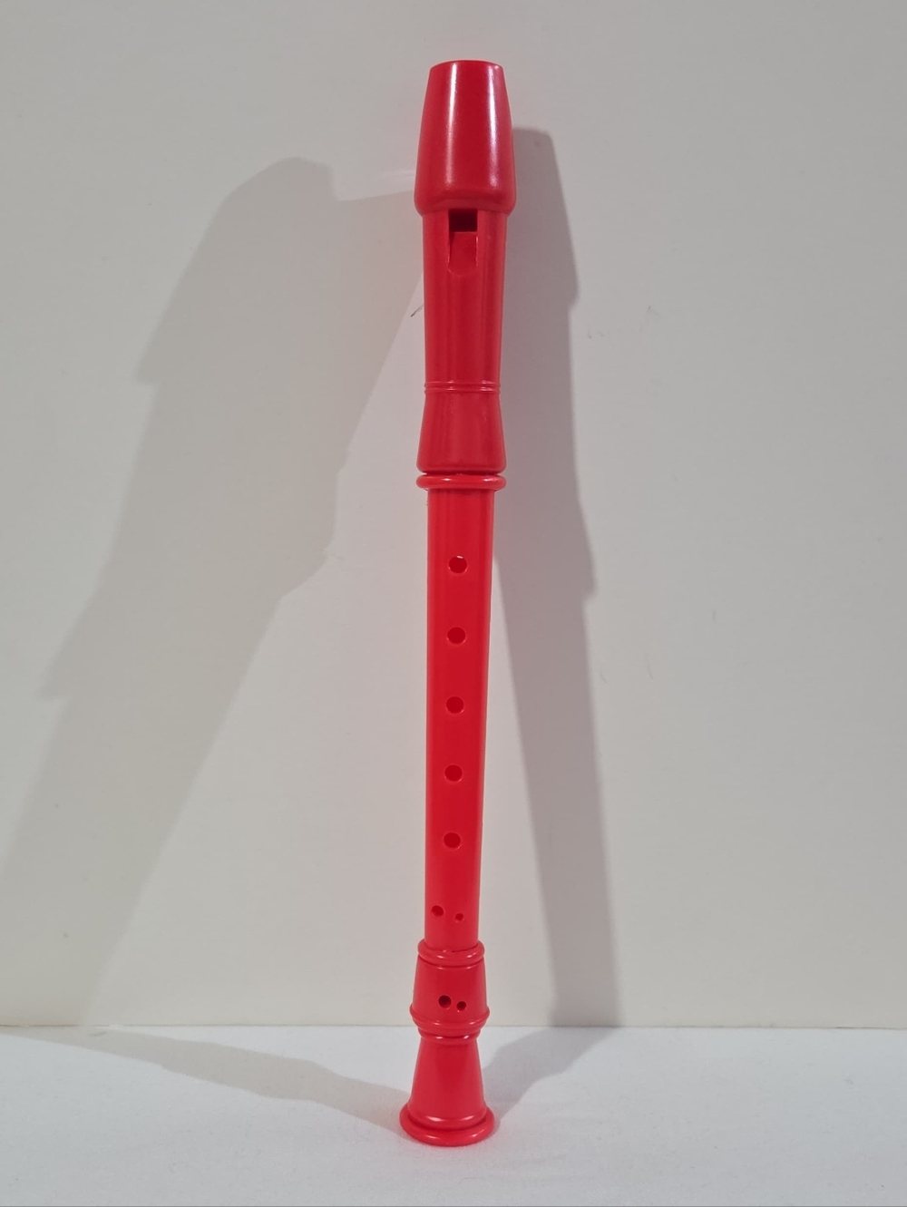 red plastic recorder